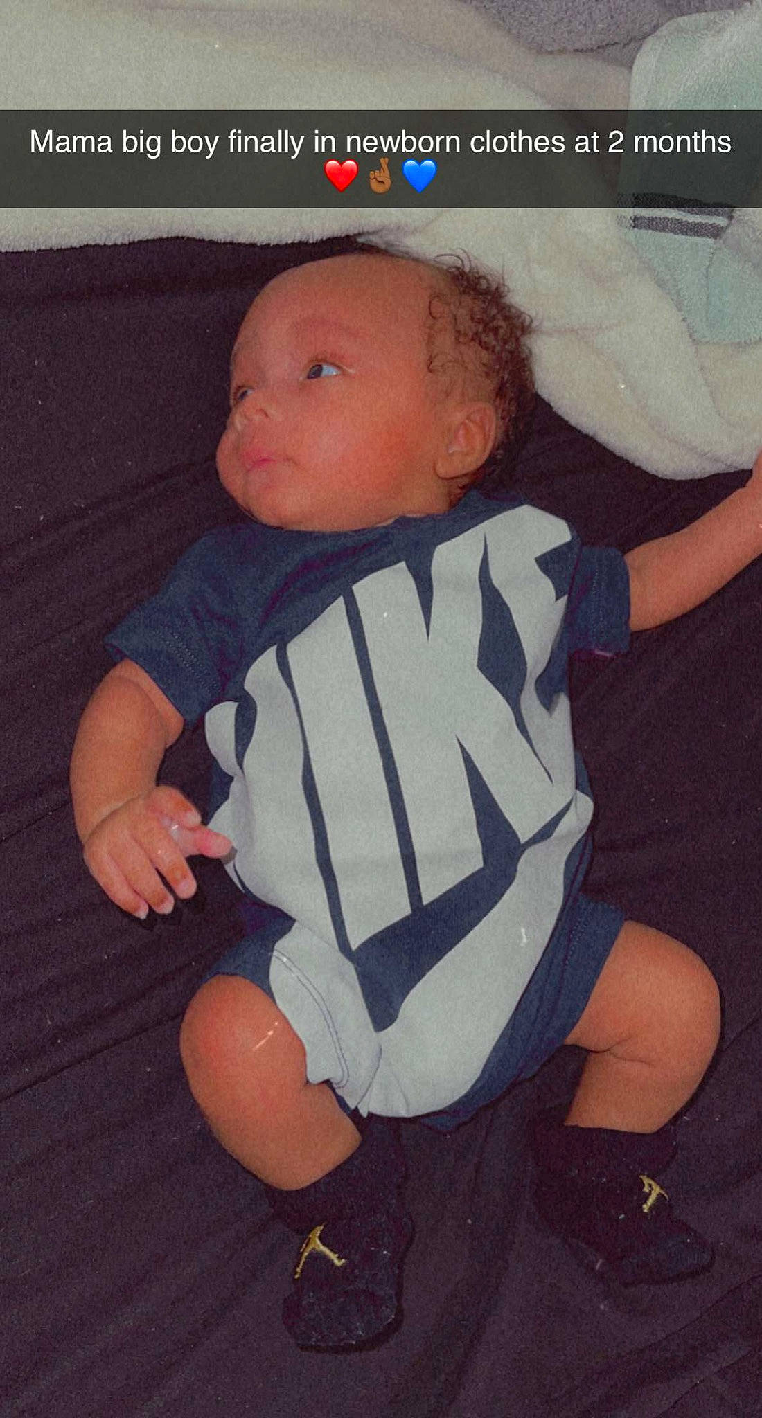 Celestino Betance is registered to the contest to win money with this photo: baby, baby_products, baby_toddler_clothing, cheek, comfort, cool, finger, font, fun, happy, head, knee, linens, orange, person, sleeve, stuffed_toy, t_shirt, thigh, thumb