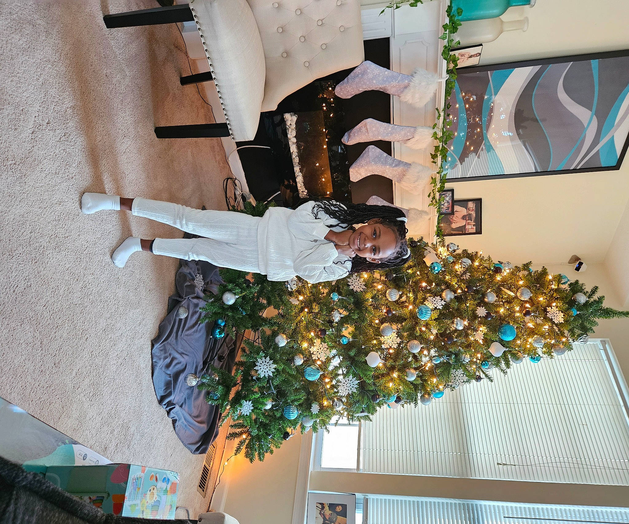 Isabella joined the competition — help win amazing prizes! christmas, christmas_decoration, christmas_ornament, christmas_tree, event, fun, holiday, interior_design, joy, ornament, person, plant, room, smile, tradition, tree, visual_arts, world