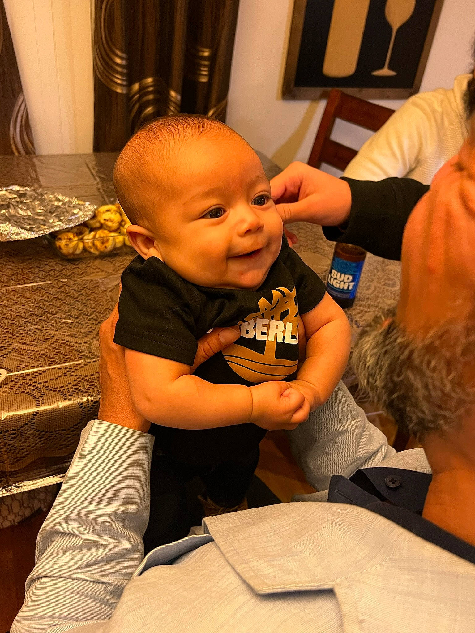 Luis is registered to the contest to win money with this photo: baby, baby_toddler_clothing, cheek, child, comfort, curtain, event, finger, flooring, fun, gesture, happy, nail, person, room, sitting, smile, t_shirt, thumb, toddler