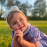 Khelani joined the competition — help win amazing prizes! child, toddler, girl, headband, bow, purple_dress, outdoor, grass, sunlight, portrait, cute, daylight, nature, expression, face, hands, soft_focus, summer, happy, young