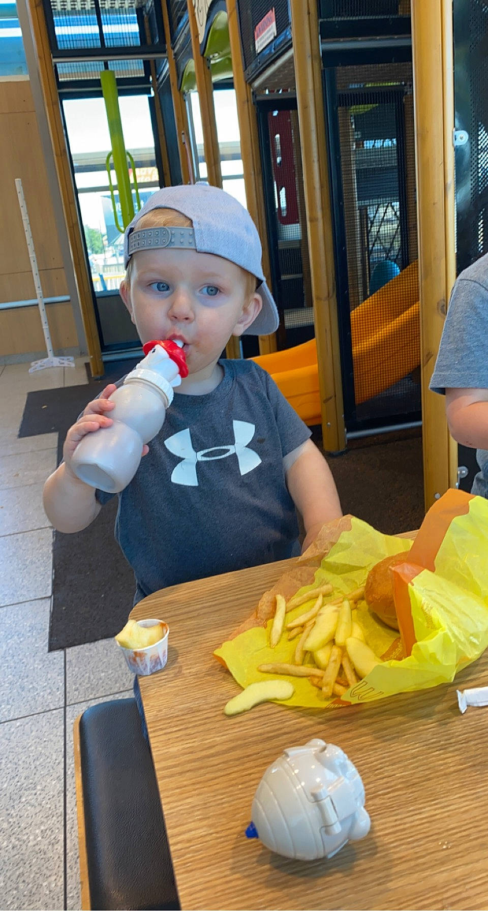 Easton joined the competition — help win amazing prizes! breakfast, canadian_cuisine, chair, child, comfort_food, eating, fast_food, finger_food, food, french_fries, furniture, hat, headwear, junk_food, person, plate, sitting, surprise, table, tableware