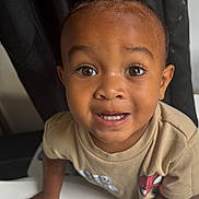 Kemari joined the competition — help win amazing prizes! child, toddler, smiling, portrait, indoors, face, eyes, teeth, happy, sitting, standing, table, shirt, spiderman, superhero, curtain, black_background, closeup, person, photography