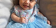 Sequoia is registered to the contest to win money with this photo: baby, smiling, dress, blue, headband, tutu, child, happy, sitting, cute, infant, clothing, fabric, portrait, indoors, person, seat, headwear, soft, joyful