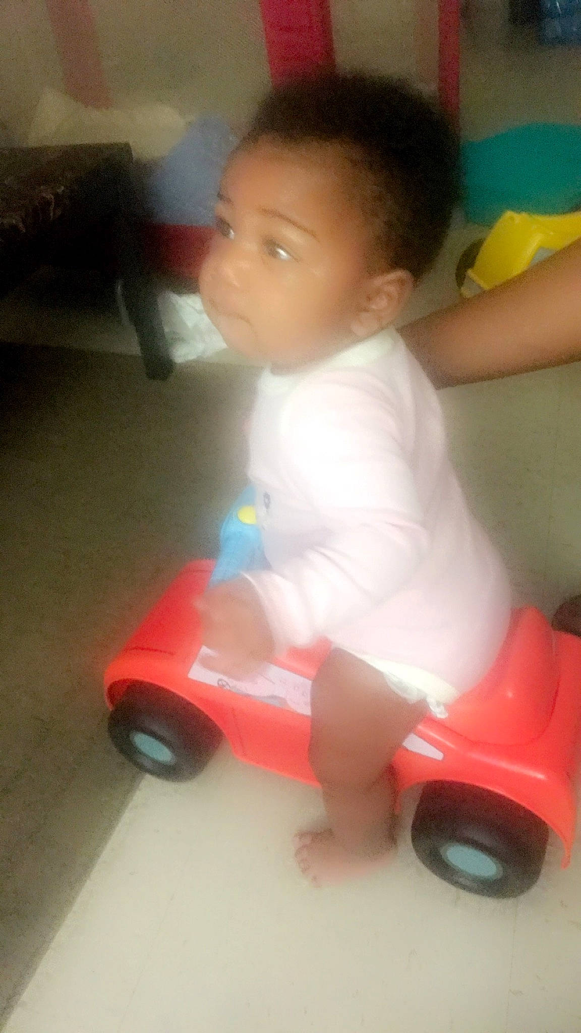 Kehlani is registered to the contest to win money with this photo: baby, baby_products, baby_toddler_clothing, baby_toys, carmine, child, flooring, fun, happy, motor_vehicle, person, plastic, play, riding_toy, sitting, tire, toddler, toy, toy_vehicle, vehicle