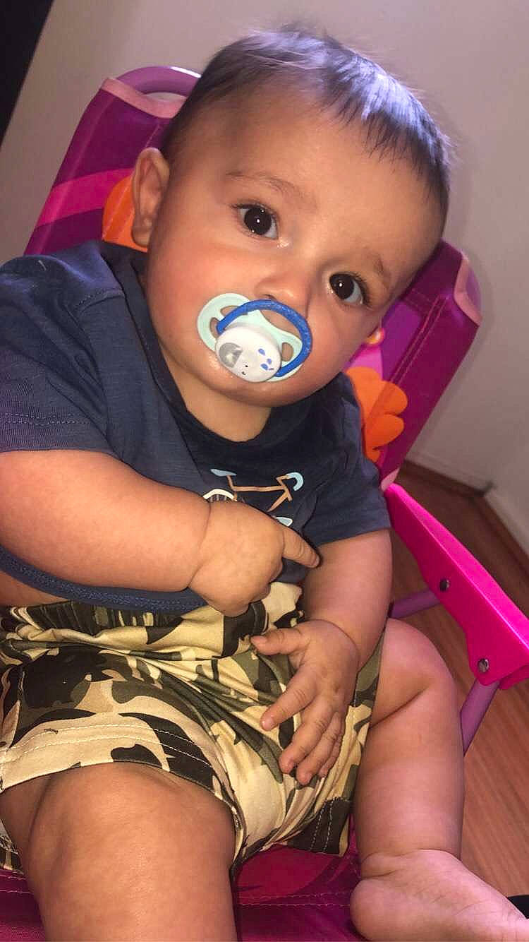 Dasan is registered to the contest to win money with this photo: baby, baby_toddler_clothing, black, cheek, child, comfort, eyelash, finger, flash_photography, fun, happy, knee, leg, mouth, organ, person, purple, skin, sleeve, thigh