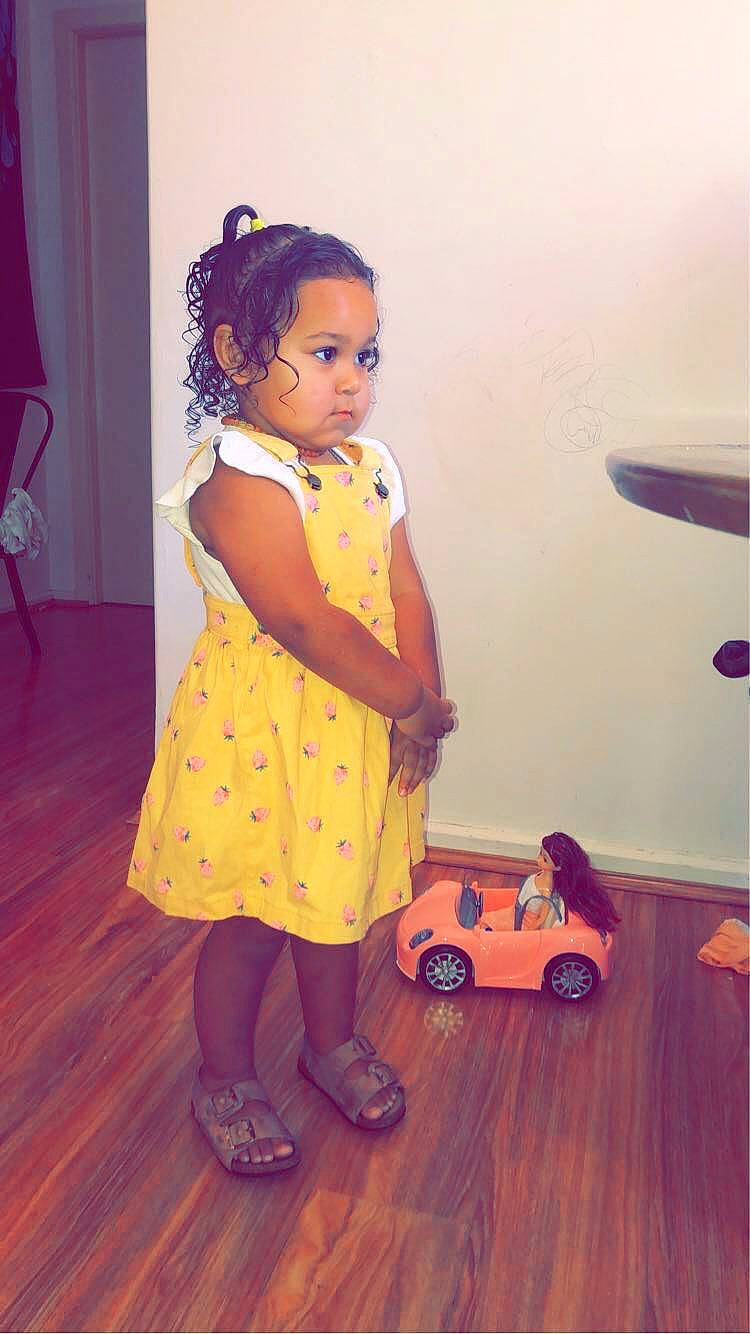 Quinn joined the competition — help win amazing prizes! aircraft, baby_toddler_clothing, car, child, fashion_design, floor, flooring, fun, happy, magenta, orange, person, skin, standing, tire, toddler, toy, toy_vehicle, vehicle, wheel