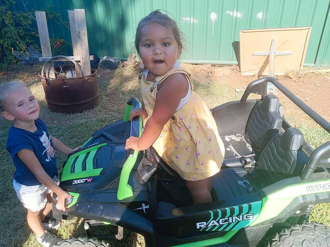 Quinn joined the competition — help win amazing prizes! automotive_design, automotive_exterior, automotive_tire, automotive_wheel_system, baby_products, child, fun, grass, green, happy, joy, leisure, motor_vehicle, person, recreation, shorts, sitting, smile, t_shirt, tire