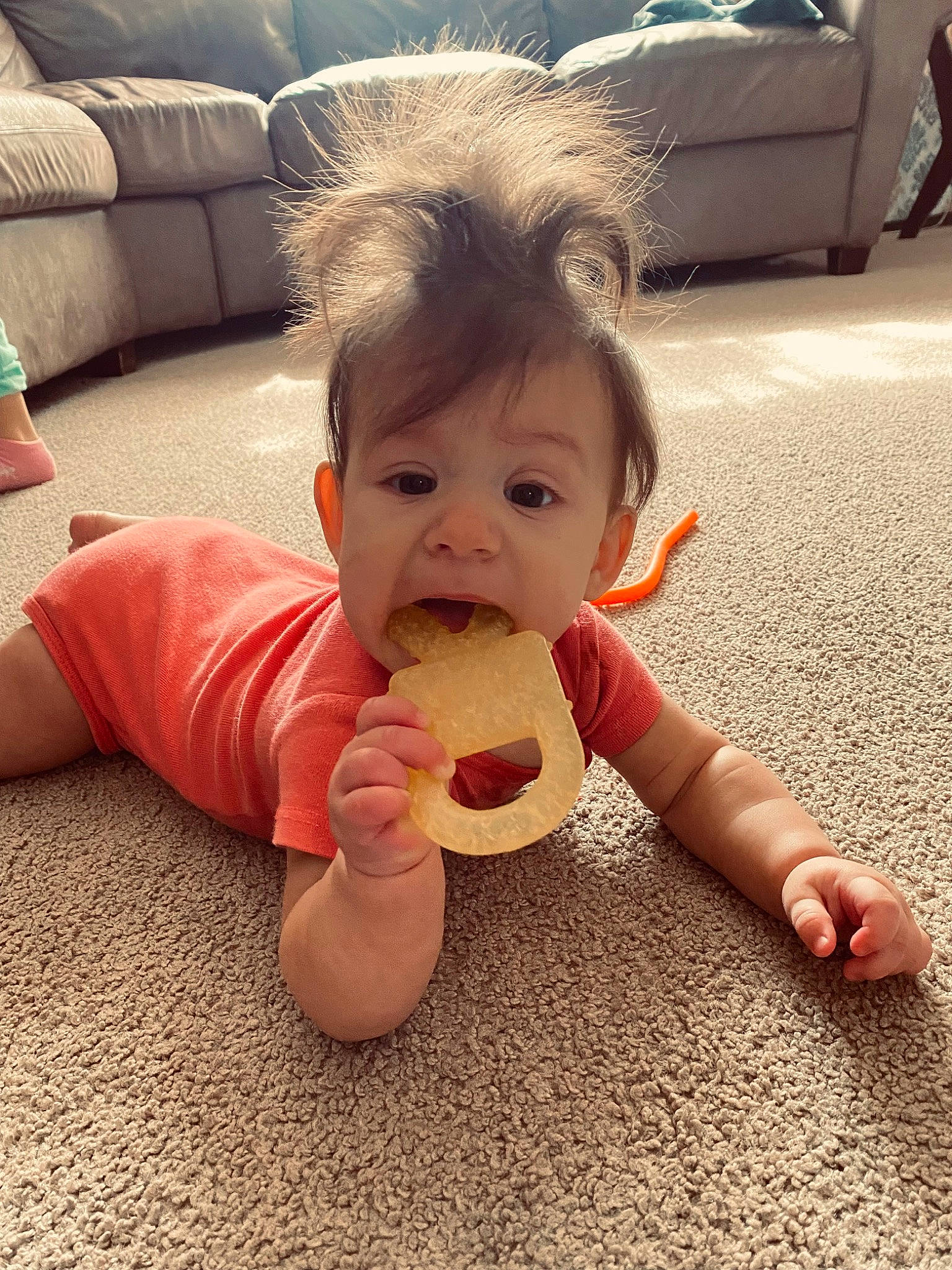 Kyla is registered to the contest to win money with this photo: baby, baby_toddler_clothing, cheek, child, comfort, cool, drinkware, finger, flooring, fun, happy, mouth, nail, nose, person, sitting, skin, thumb, tire, toddler