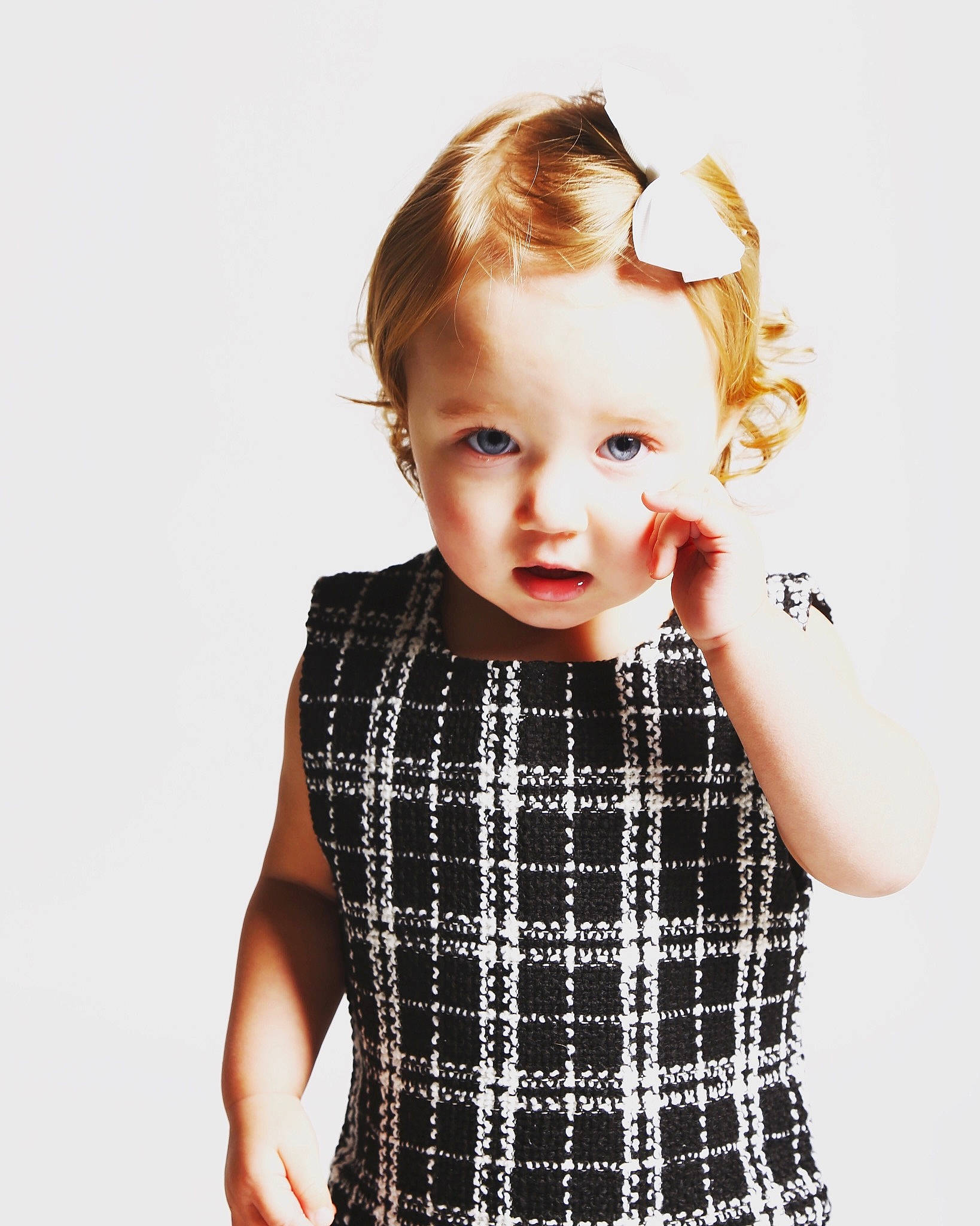 Kendal is registered to the contest to win money with this photo: blond, child, child_model, clothing, design, dress, hairstyle, neck, outerwear, pattern, person, photography, plaid, shoulder, sleeve, standing, tartan, textile, toddler, white