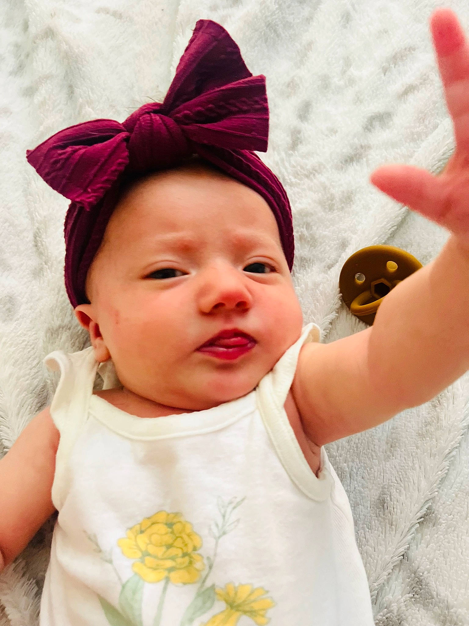 Ariella joined the competition — help win amazing prizes! baby_toddler_clothing, cheek, chin, ear, eye, eyebrow, eyelash, finger, gesture, happy, head, headgear, lip, neck, nose, person, pink, skin, sleeve, textile