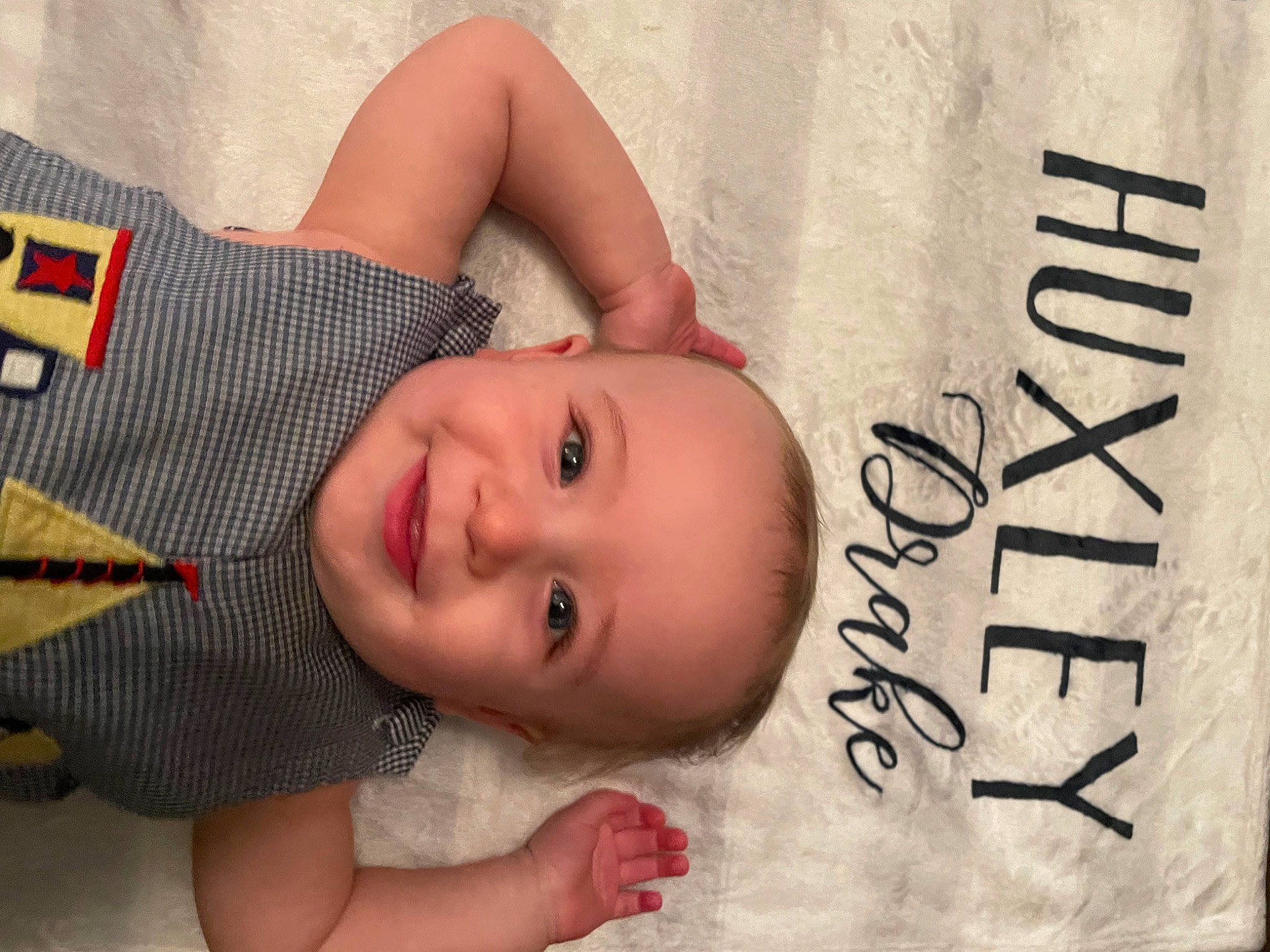 Huxley joined the competition — help win amazing prizes! baby, baby_toddler_clothing, cheek, chin, eye, eyebrow, eyelash, facial_expression, happy, head, joy, linens, lip, nose, pattern, person, product, room, skin, smile