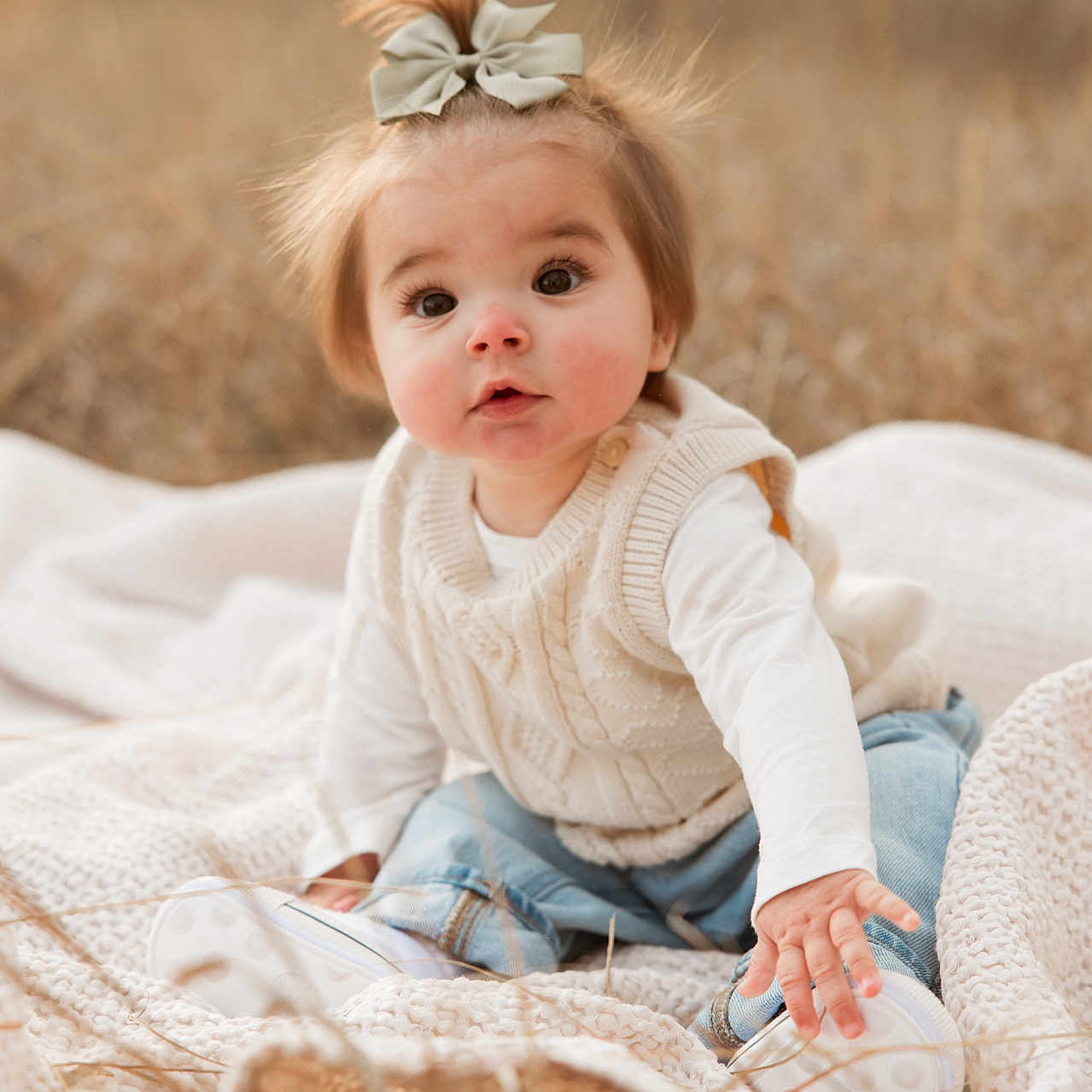 Moxley joined the competition — help win amazing prizes! baby, blonde, bodypart, clothing, couch, crawling, face, finger, furniture, hair, hand, happy, head, knitwear, pants, person, photography, portrait, sitting, smile