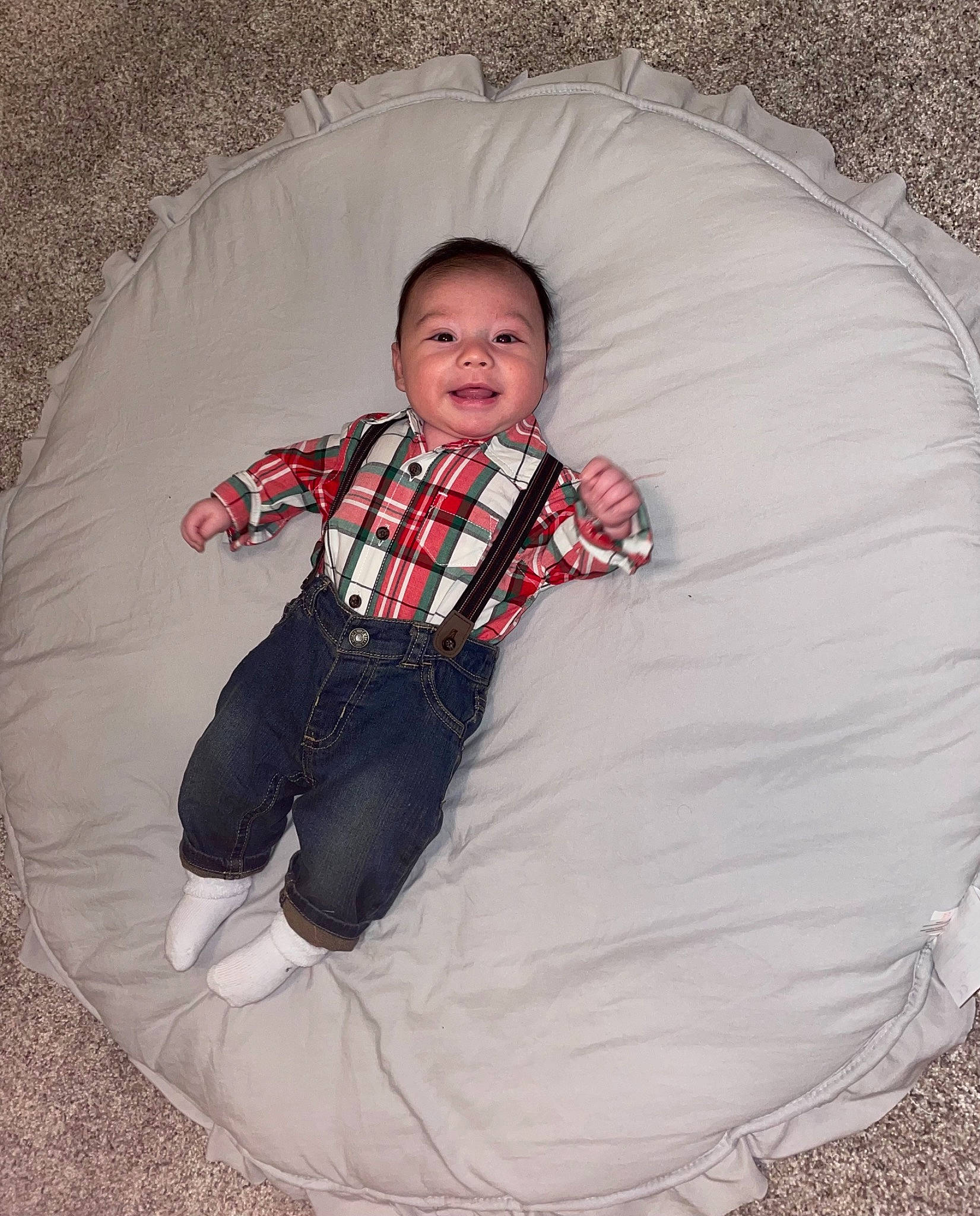 Gray is registered to the contest to win money with this photo: baby, baby_toddler_clothing, child, collar, comfort, fun, grass, linens, mammal, organ, pattern, person, recreation, sitting, sleeve, smile, t_shirt, textile, tints_and_shades, toddler