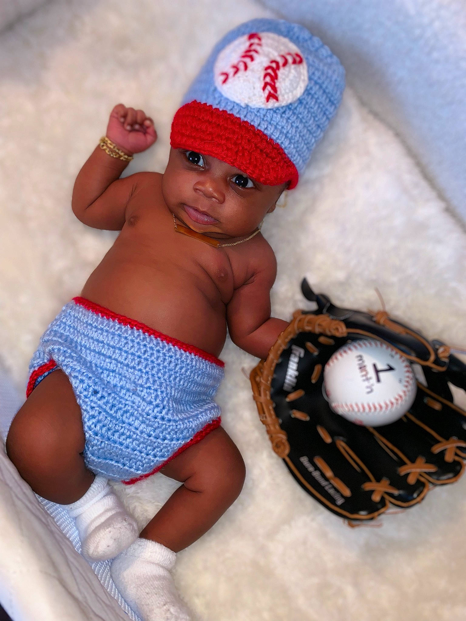 Kacen is registered to the contest to win money with this photo: abdomen, beanie, cap, child, fun, hat, headgear, headwear, infant, person, product, toddler