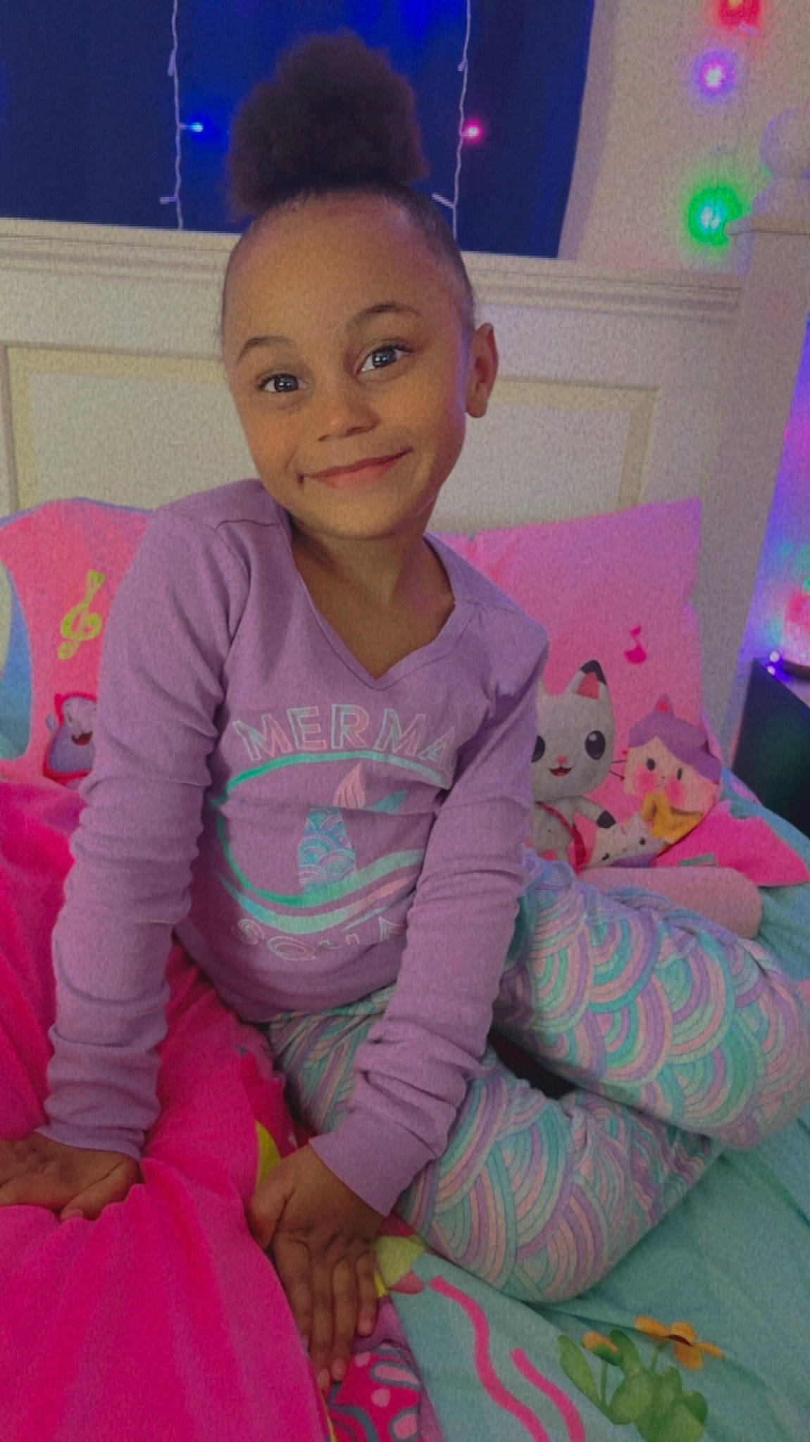 Anastasia is registered to the contest to win money with this photo: baby_toddler_clothing, child, clothing, comfort, finger, fun, happy, head, human_body, joy, lap, magenta, person, pink, purple, sitting, skin, sleeve, smile, t_shirt