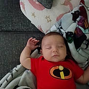 Theodore joined the competition — help win amazing prizes! baby, sleeping, onesie, red_clothing, blanket, couch, pillow, infant, resting, cozy, indoor, child, cute, peaceful, soft, home, portrait, face, head, relaxing