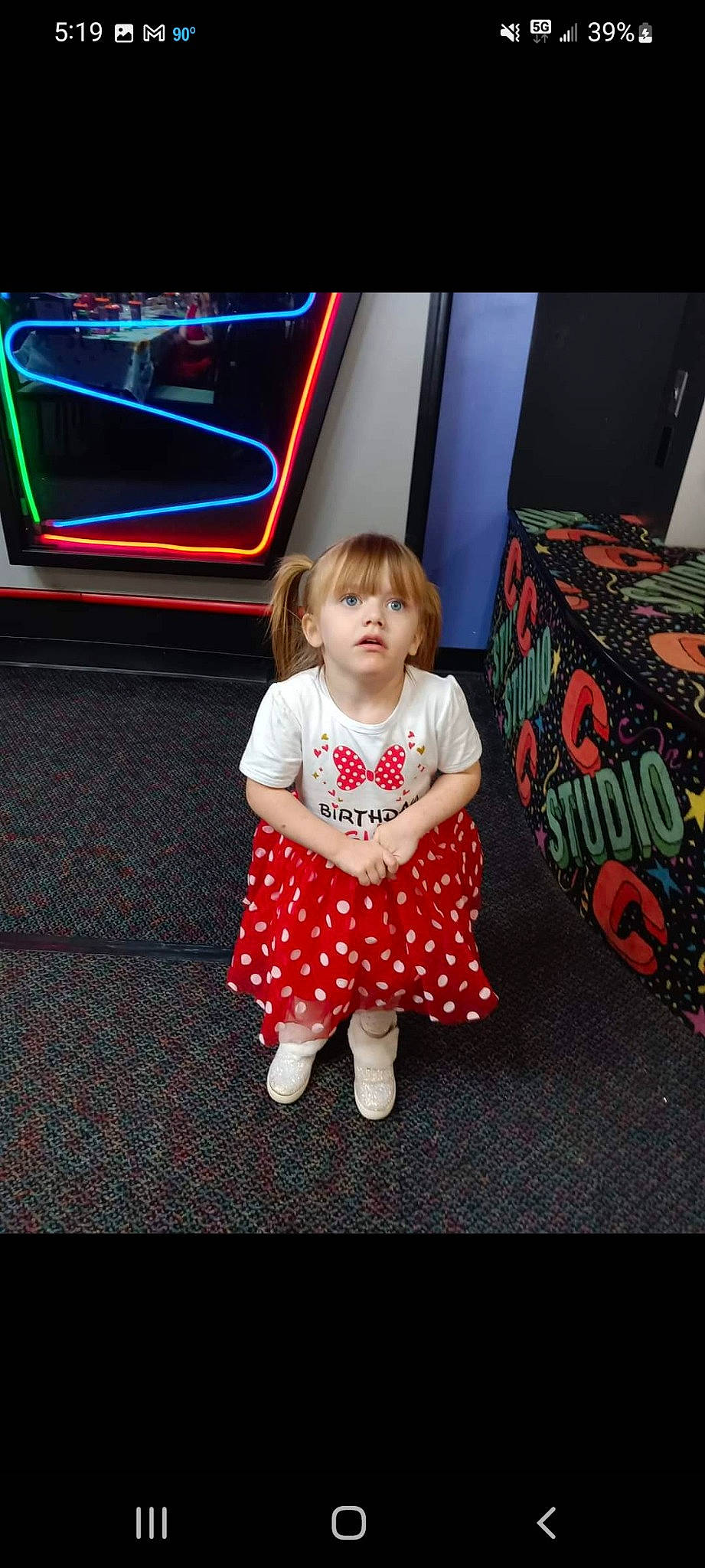 Winter is registered to the contest to win money with this photo: automotive_design, baby, baby_toddler_clothing, child, dress, floor, flooring, fun, hairstyle, happy, human_body, magenta, pattern, person, sitting, skin, sleeve, t_shirt, television_set, toddler