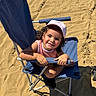 Naslhey joined the competition — help win amazing prizes! child, toddler, girl, smiling, beach, sand, outdoor, sunny, summer, chair, folding_chair, baseball_cap, pink_clothing, portrait, seated, curly_hair, happy, face, shadow, vacation
