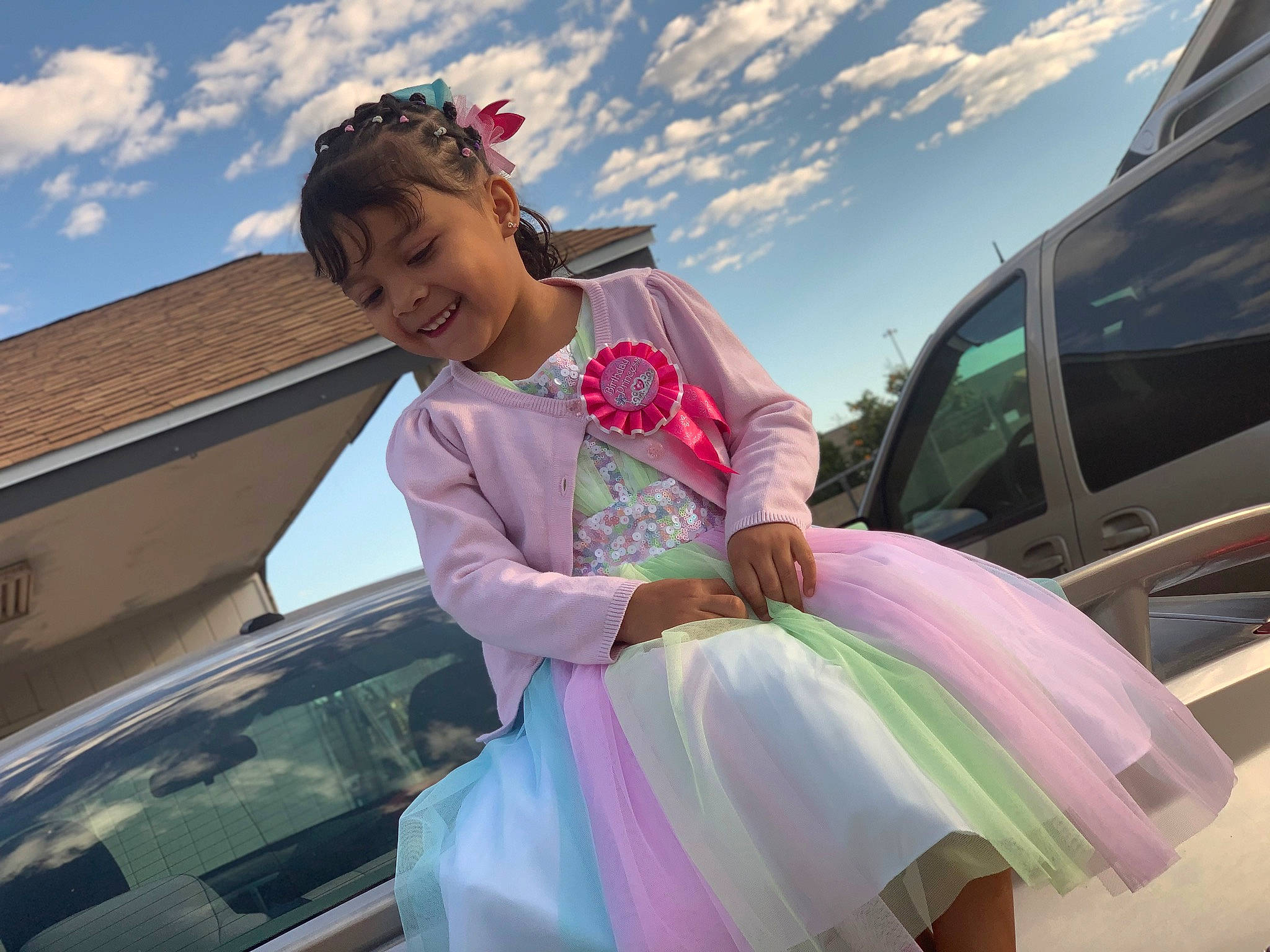 Jaylani is registered to the contest to win money with this photo: automotive_window_part, car, child, cool, costume, dress, family_car, fun, happy, joy, luxury_vehicle, person, photography, pink, shoulder, sky, smile, vacation, vehicle