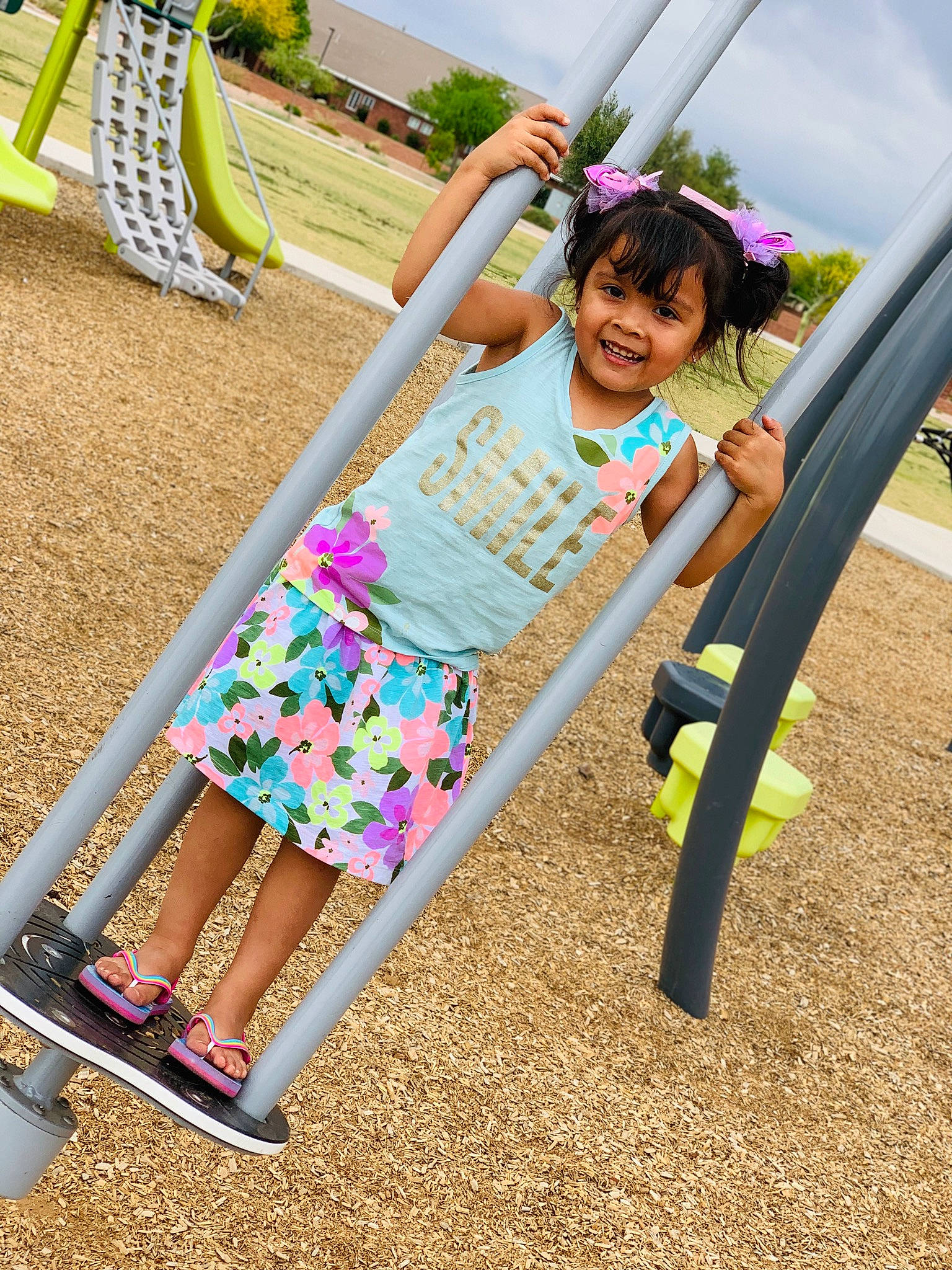 Jaylani joined the competition — help win amazing prizes! child, daughter, joy, leisure, outdoor_play_equipment, person, pink, plant, play, playground, swing, toddler, waist