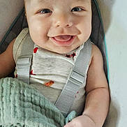 Jason joined the competition — help win amazing prizes! baby, smiling, infant, blanket, seat, straps, child, cute, happy, portrait, indoor, skin, face, person, clothing, furniture, baby_boy, hand, comfort, closeup