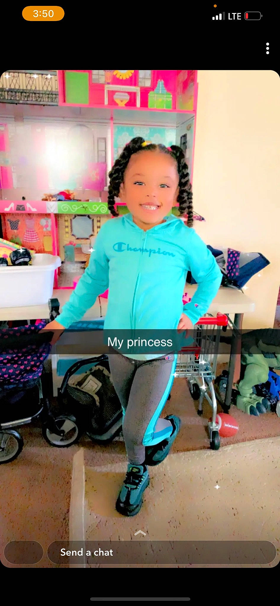 Aryanna is registered to the contest to win money with this photo: bag, balance, chair, electric_blue, happy, human_leg, joy, knee, leisure, luggage_and_bags, person, shoe, sleeve, smile, sneakers, sportswear, standing, t_shirt, table, thigh