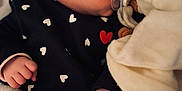 Abby participe au concours pour gagner de l'argent avec cette photo : baby, black_clothing, blanket, child, close_up, cozy, cute, face, hand, heart_pattern, indoors, infant, newborn, pacifier, peaceful, plush_toy, resting, sleeping, soft_texture, warm_lighting