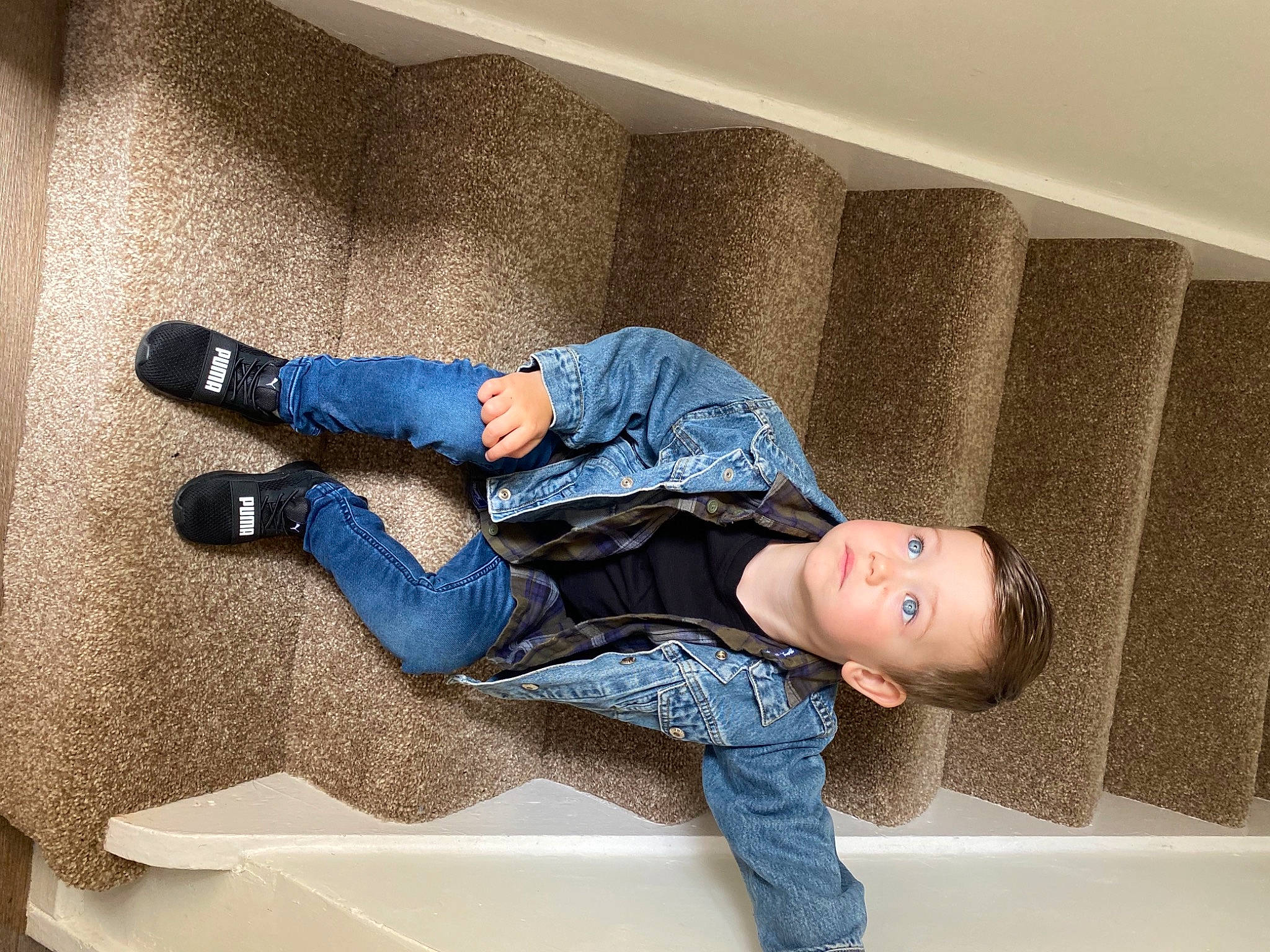Martin is registered to the contest to win money with this photo: child, comfort, denim, electric_blue, floor, flooring, fun, human_leg, jeans, joint, knee, leg, leisure, person, room, shoe, sitting, sleeve, sneakers, toddler