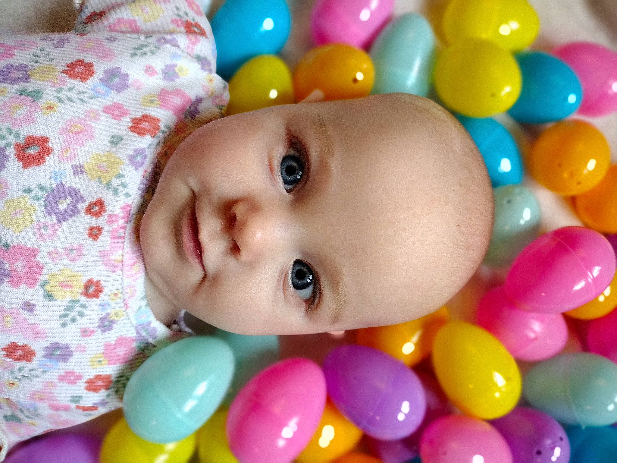 Emerald joined the competition — help win amazing prizes! baby, baby_playing_with_toys, cheek, child, eye, eyelash, facial_expression, fun, happy, head, iris, nose, organ, person, pink, product, skin, smile, toddler, toy