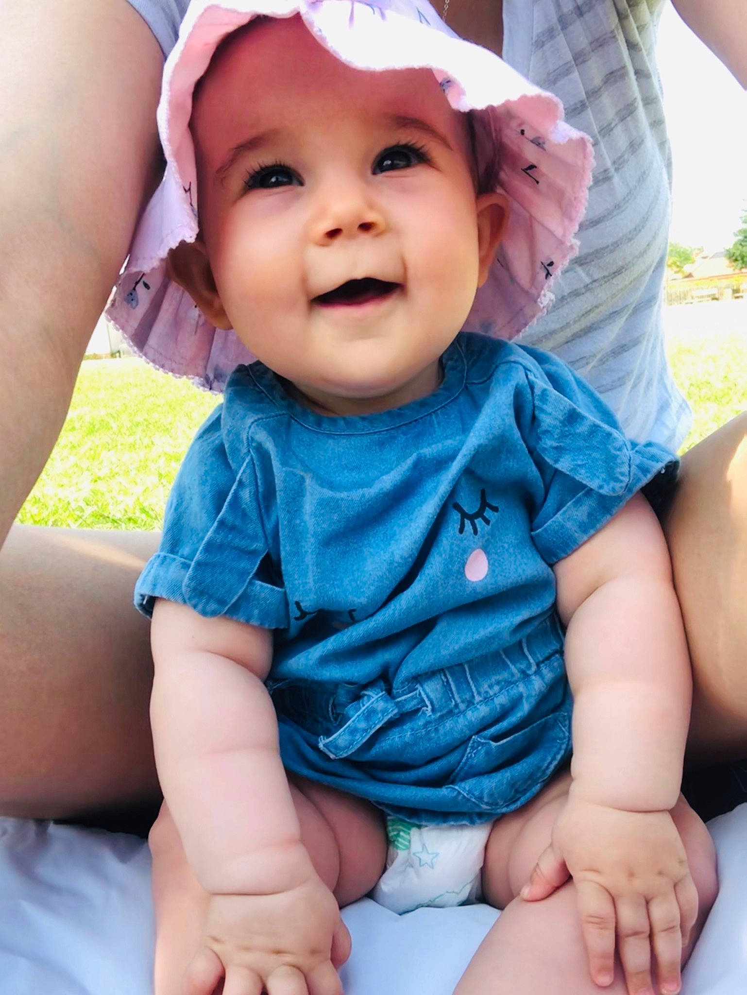 Lucie is registered to the contest to win money with this photo: baby, baby_toddler_clothing, child, headwear, person, sitting, skin, smile, toddler