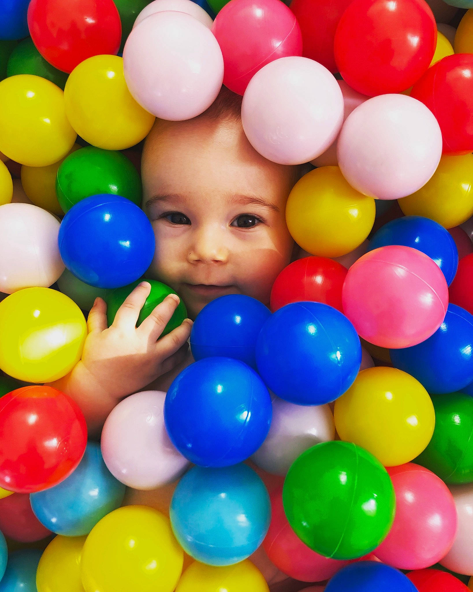 Lucie is registered to the contest to win money with this photo: baby_playing_with_toys, baby_toys, ball, ball_pit, balloon, child, fun, person, play, toy