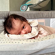 Zayra participe au concours pour gagner de l'argent avec cette photo : baby, bassinet, blanket, bouncer, close_up, crib, fabric, face, hair, head, indoor, infant, mesh, nursery, onesie, pillow, portrait, sleepy, soft_lighting, stars_pattern