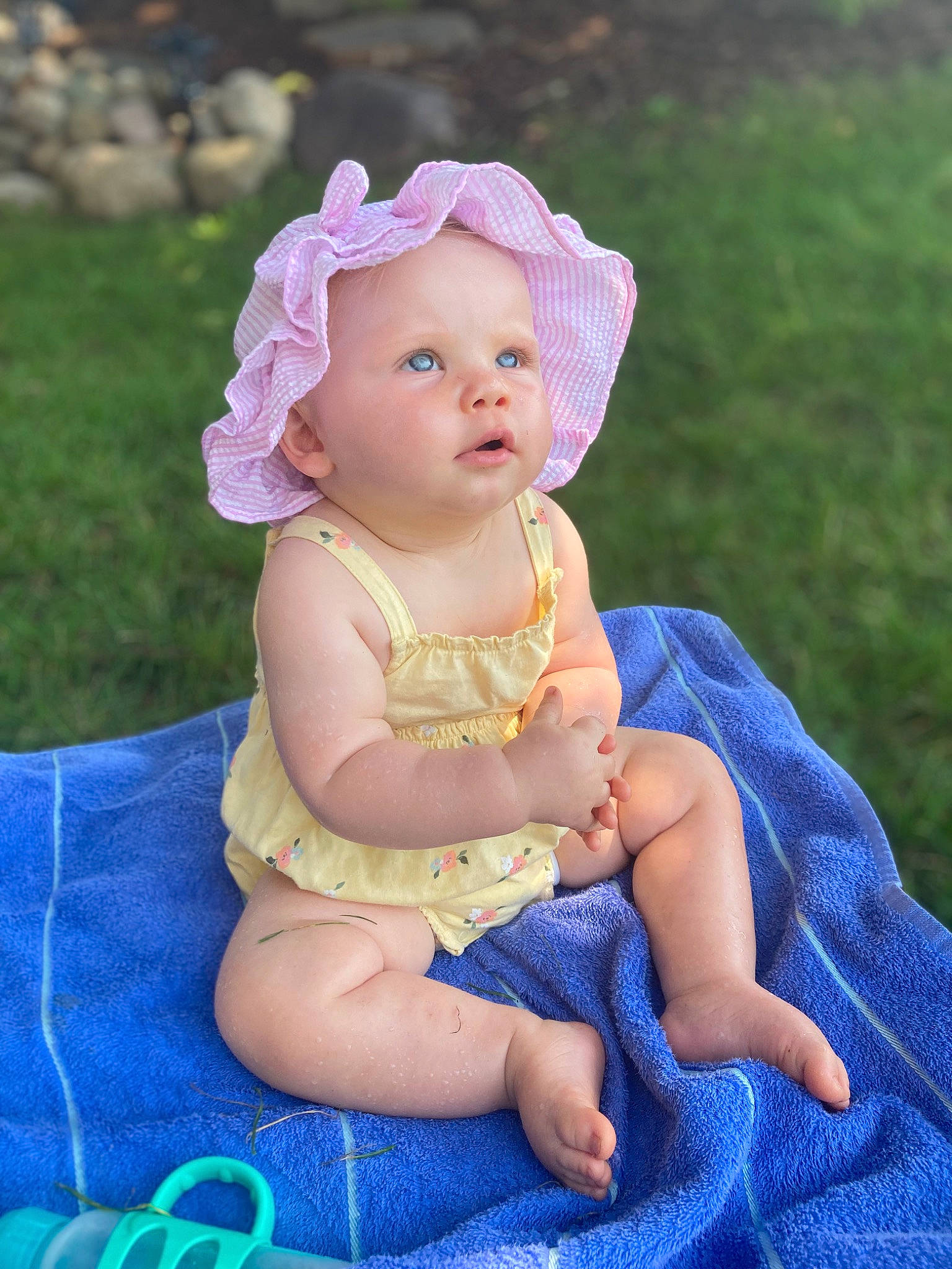 Cambree is registered to the contest to win money with this photo: baby, baby_toddler_clothing, child, dress, electric_blue, fashion_accessory, fun, grass, happy, headband, headpiece, headwear, jewellery, necklace, pattern, person, pink, purple, sitting, skin