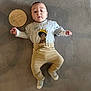 Noah joined the competition — help win amazing prizes! baby, infant, lying_down, clothing, tshirt, pants, socks, wooden_sign, milestone, soft_surface, gray_background, cute, young_child, portrait, indoors, casual, baby_boy, child, milestone_marker, laying