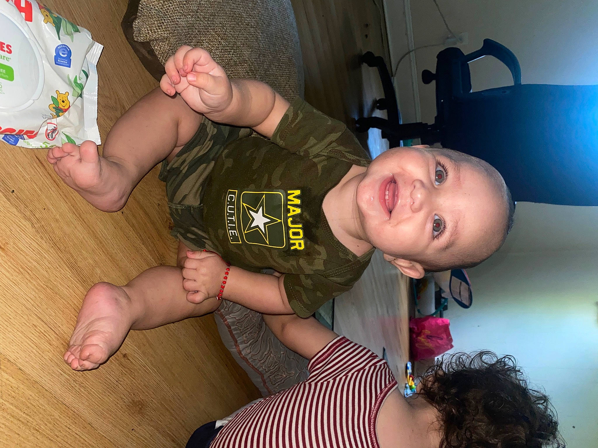 Juan is registered to the contest to win money with this photo: arm, baby_toddler_clothing, comfort, elbow, finger, flash_photography, flooring, foot, fun, happy, joint, knee, leg, mouth, muscle, person, smile, sock, t_shirt, thigh
