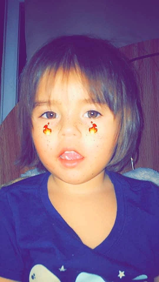 Leila is registered to the contest to win money with this photo: bangs, cheek, child, chin, ear, eye, eyebrow, face, forehead, hair, hairstyle, head, iris, jaw, lip, nose, person, purple, skin, toddler