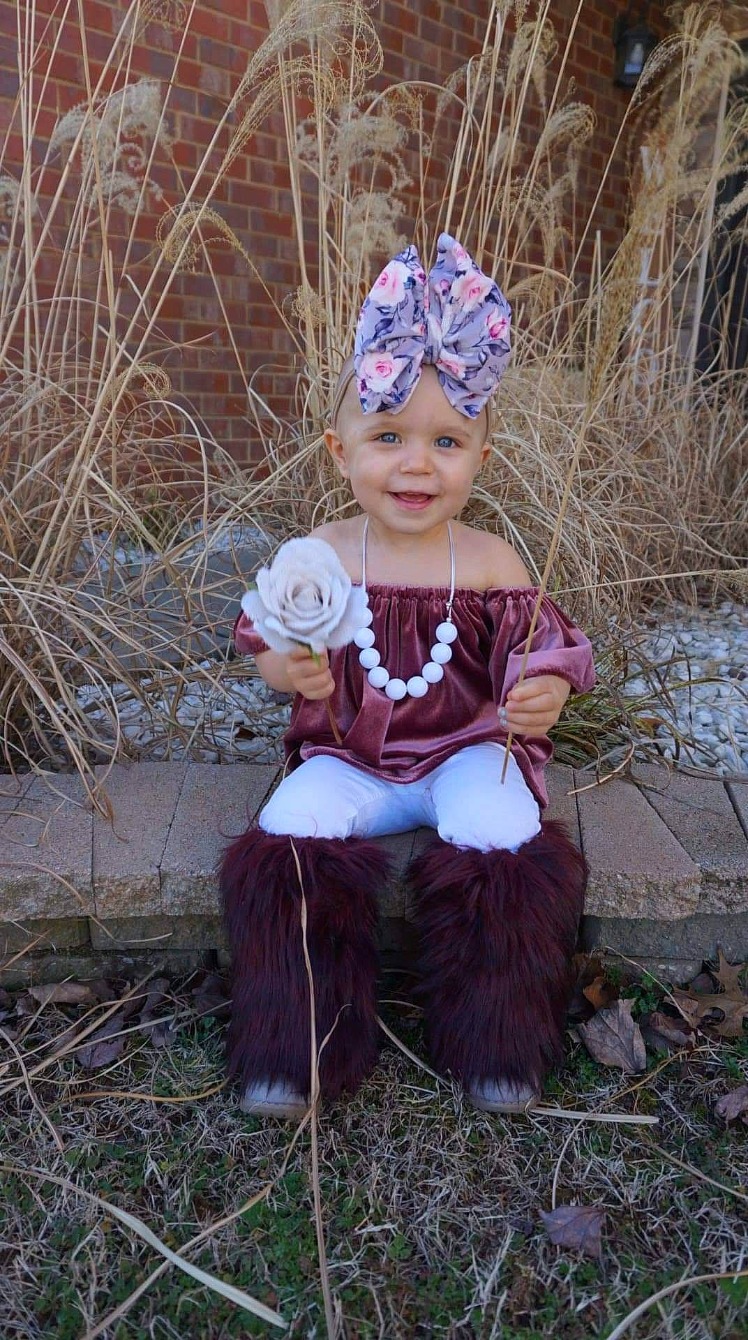 Meadow is registered to the contest to win money with this photo: adaptation, art, baby, baby_toddler_clothing, chair, child, costume_hat, dress, eye, fawn, grass, happy, headband, headgear, headpiece, headwear, joy, people_in_nature, person, smile