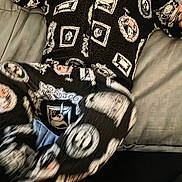 James joined the competition — help win amazing prizes! baby, child, infant, crying, onesie, clothing, black, white, pink, pattern, face, mouth_open, eyes_closed, lying_down, pillow, blanket, bed, indoor, person, cute