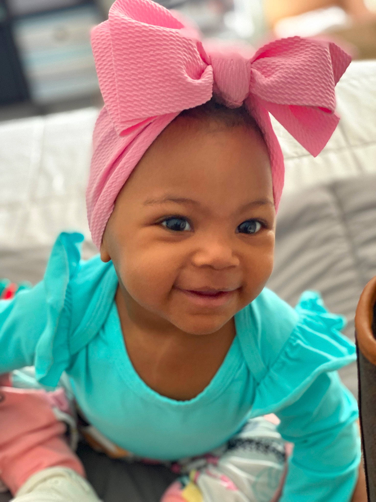 Nylah is registered to the contest to win money with this photo: baby, beauty, cap, child, cool, eyebrow, face, facial_expression, fun, happy, headband, headpiece, human_body, leisure, lip, magenta, person, pink, skin, smile