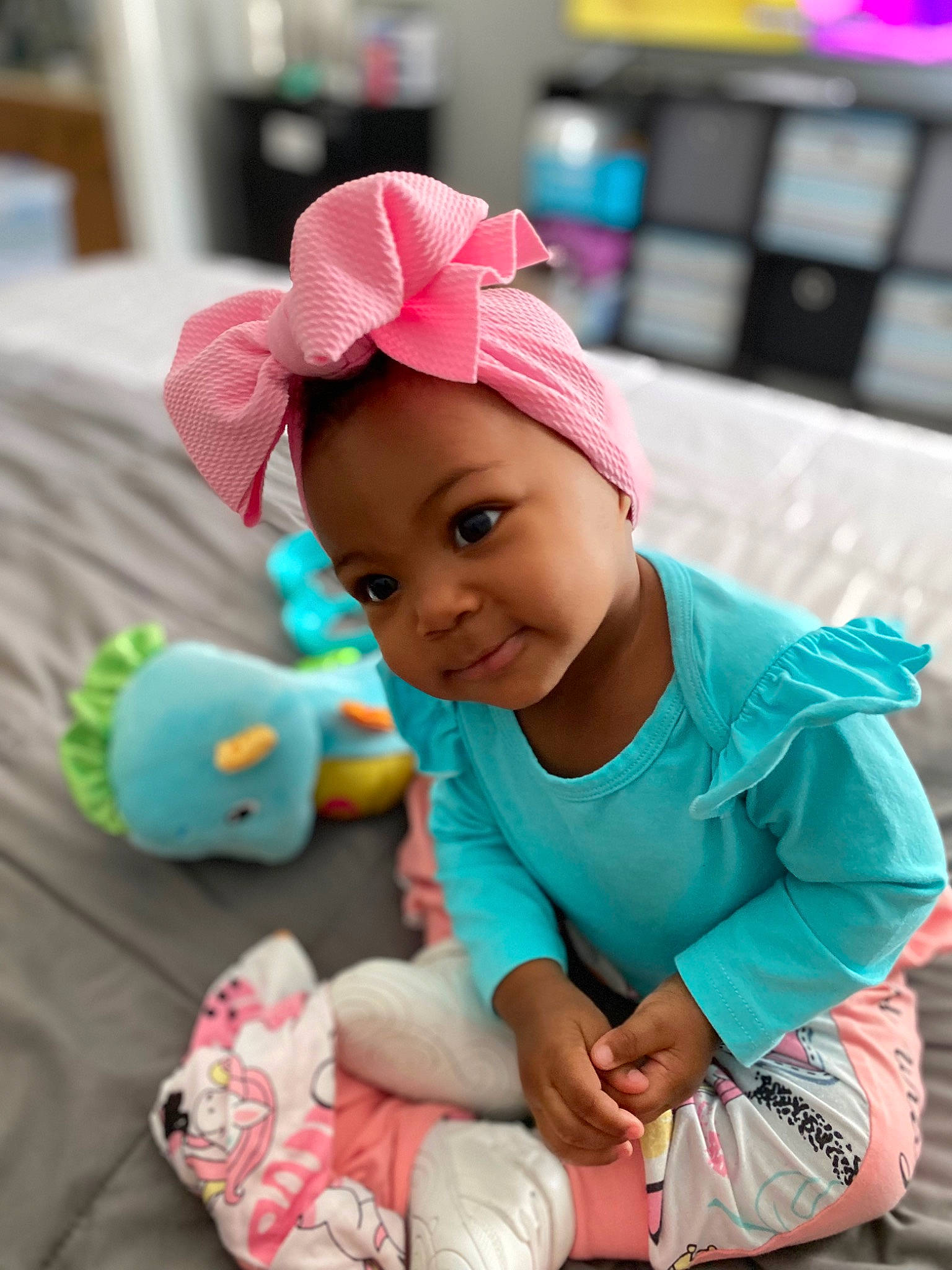 Nylah joined the competition — help win amazing prizes! baby, baby_playing_with_toys, baby_toddler_clothing, cap, child, face, facial_expression, fashion_accessory, fun, happy, hat, leisure, magenta, person, pink, product, purple, skin, smile, toddler