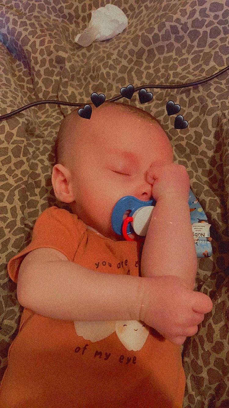 David is registered to the contest to win money with this photo: baby, baby_products, baby_sleeping, baby_toddler_clothing, bedtime, cheek, child, comfort, eyelash, finger, linens, mouth, nose, pattern, person, pink, room, skin, textile, toddler