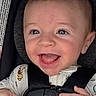 baby, baby_clothes, blanket, blue_eyes, car_seat, child, close_up, clothing, cute, hands, happy, indoor, infant, person, portrait, seat_belt, sitting, smiling, soft_toy, young_child