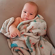 Matthew is registered to the contest to win money with this photo: baby, blanket, child, infant, cute, face, skin, soft, comfort, expression, person, sitting, indoors, relaxing, young, wrapped, warm, cozy, plush, portrait