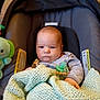 Matthew joined the competition — help win amazing prizes! baby, infant, car_seat, blanket, pacifier, striped_clothing, soft_toy, green, knitted, seat, indoors, child, cute, person, face, expression, comfort, safety, head, holding
