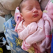 Heaven is registered to the contest to win money with this photo: newborn, baby, sleeping, pink_blanket, soft_fabric, wrapped, peaceful, infant, cute, cozy, bed, bedding, pattern, sun, moon, indoor, portrait, child, resting, warm