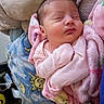 newborn, baby, sleeping, pink_blanket, soft_fabric, wrapped, peaceful, infant, cute, cozy, bed, bedding, pattern, sun, moon, indoor, portrait, child, resting, warm