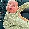 Heaven joined the competition — help win amazing prizes! baby, newborn, infant, onesie, green_clothing, floral_pattern, puckered_lips, sleeping, car_interior, dashboard, hand_holding, child, cute, face, skin, person, portrait, seat, comfortable, peaceful