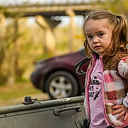 Harper joined the competition — help win amazing prizes! child, girl, pigtails, jacket, pink_shirt, outdoor, car, bridge, confident, standing, portrait, candid, person, clothing, vehicle, nature, expression, young, cute, fashion