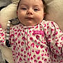 baby, infant, face, onesie, pink, leopard_print, pacifier, pillow, soft_texture, clothing, cute, child, portrait, lying_down, indoor, young_child, calm, beads, closeup, person
