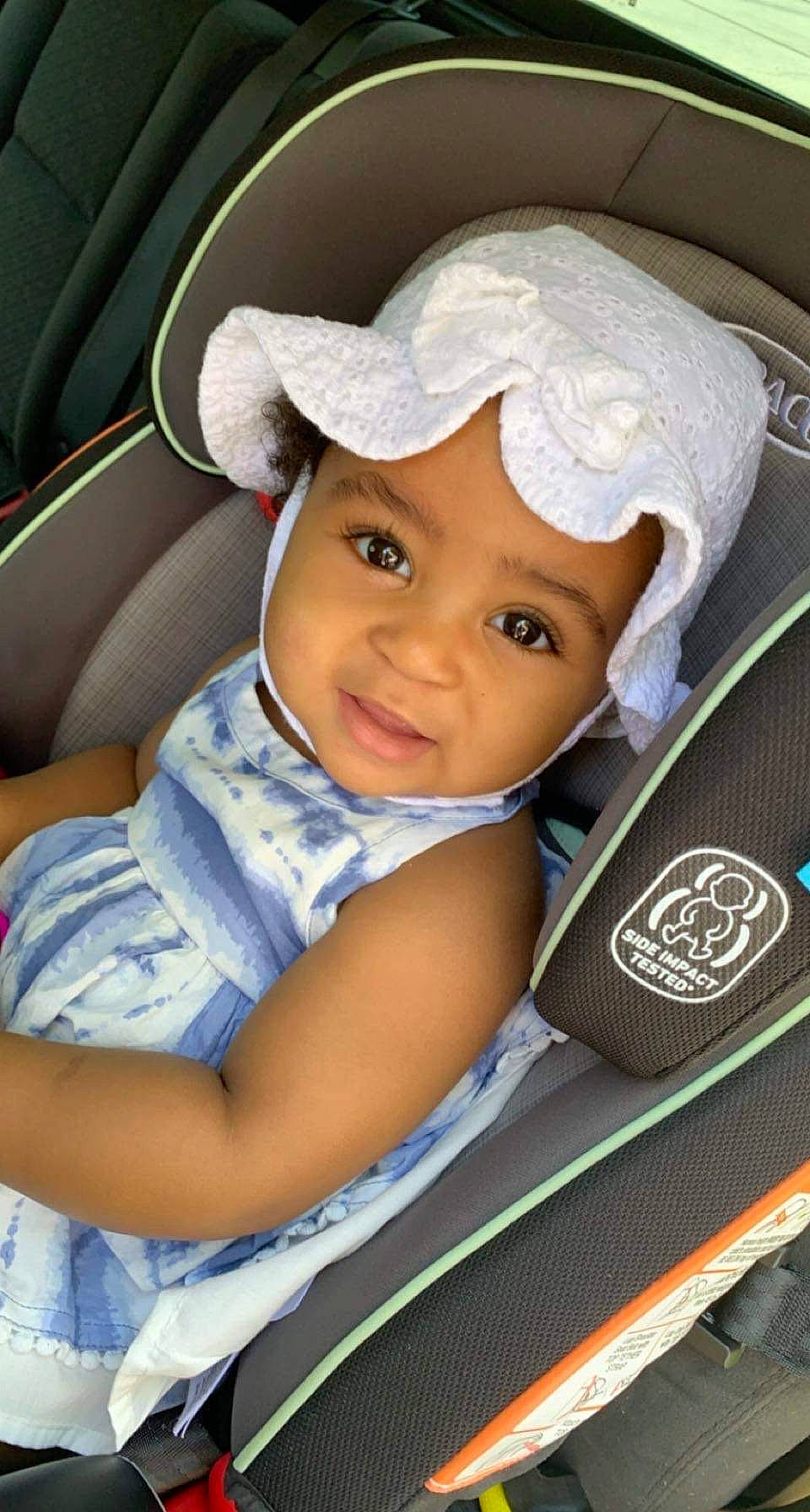 Alex is registered to the contest to win money with this photo: auto_part, baby, baby_carriage, baby_products, baby_toddler_clothing, cap, car_seat, car_seat_cover, child, chin, comfort, electric_blue, eye, fashion_accessory, happy, headwear, person, product, seat_belt, smile